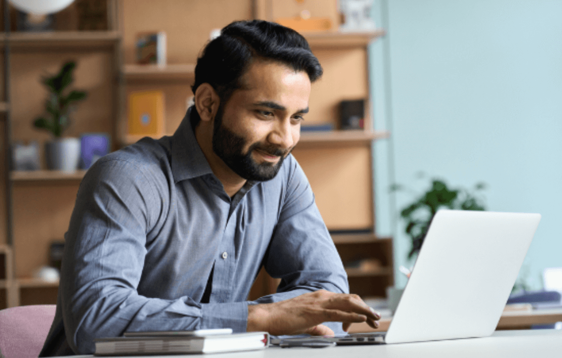 Person researching keywords on a laptop